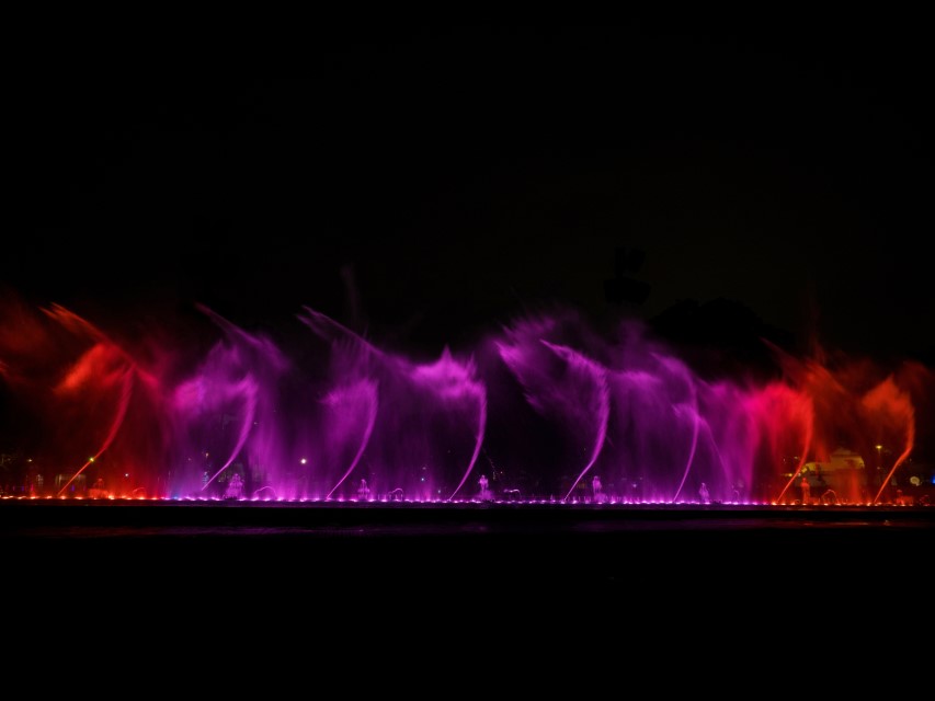 Colorful illuminated water fountains light art installation Circuito magico del Agua in Parque de la Reserva Lima Peru South America
