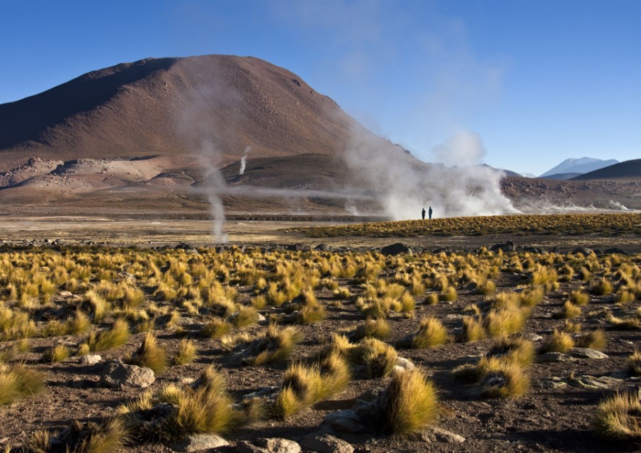El Tatio geyser field in the Andes Mountains of northern Chile at 4,200 meters above mean sea level. The best time to see them is at sunrise when each geyser is surmounted by a column of steam.